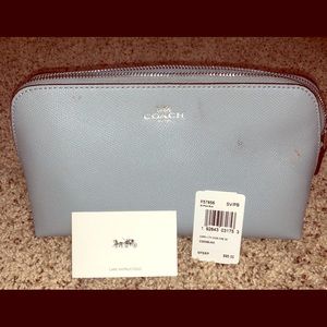 Shiny baby blue/metallic coach makeup bag